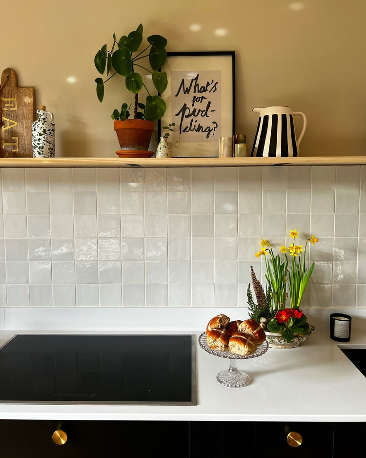 Gloss white tiles over kitchen splashback