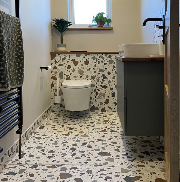 Terrazzo porcelain tiles in small toilet