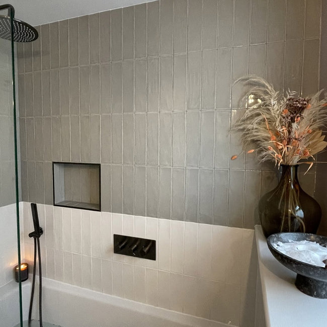 Plain tiles over bathroom wall